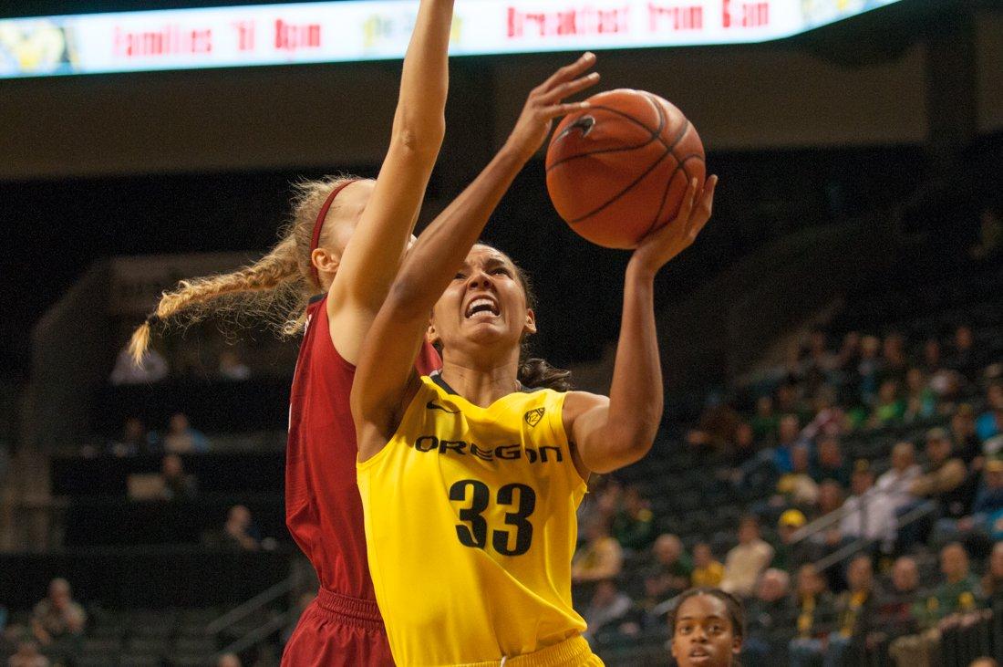 Lexi Peterson (33) is fouled from behind as she approaches the hoop. Oregon Ducks upset No. 19 Stanford at Matthew Knight Arena in Eugene, Oregon on March 1st, 2015. (Cole Elsasser/Emerald)