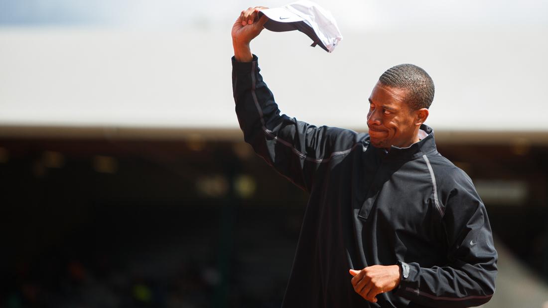 Oregon track and field head coach Robert Johnson waves his hat towards the crowd as his name is announced at the meet. (Taylor Wilder/Emerald)