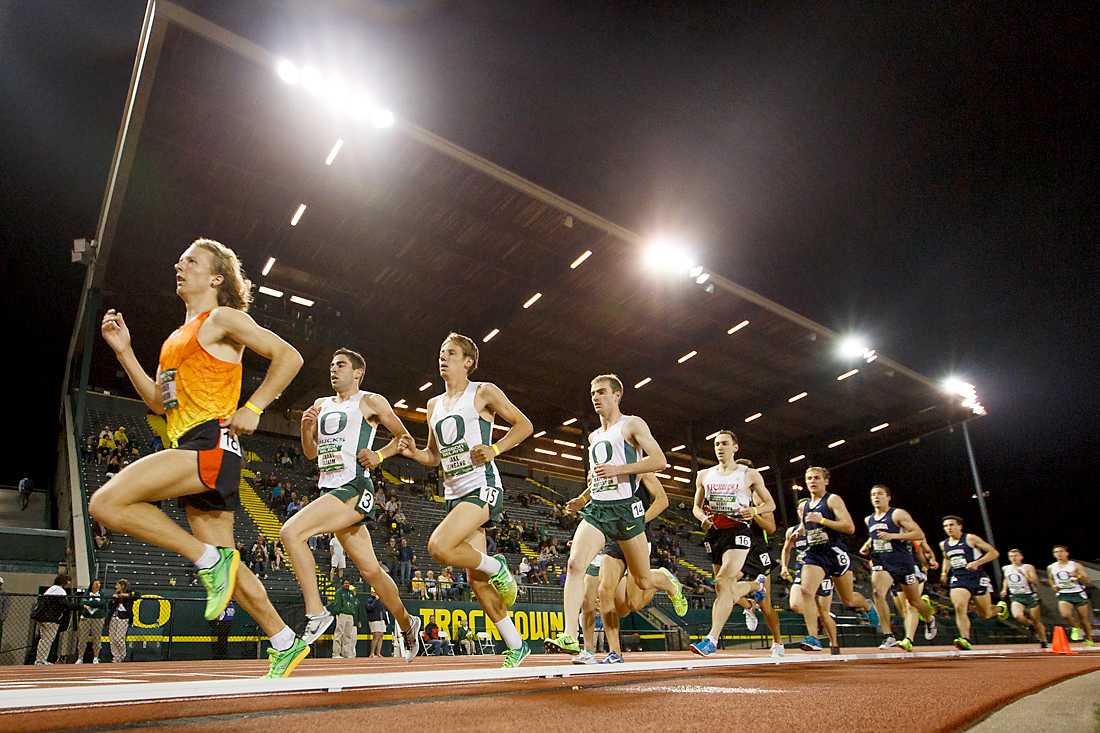 Runners race past the grandstands in the men&#8217;s McChesney Jr. 5000 meter run. The University of Oregon hosts the annual Oregon Relays at Hayward Field in Eugene, Ore. on Friday, April 17, 2015. (Ryan Kang/Emerald)