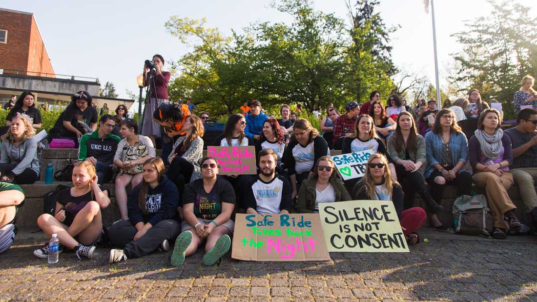 Safe Ride workers show their support at the rally. The ASUO Women&#8217;s Center and Sexual Assault Support Services of Lane County present Take Back the Night in Eugene, Ore. on Thursday, April 30, 2015. (Taylor Wilder/Emerald)