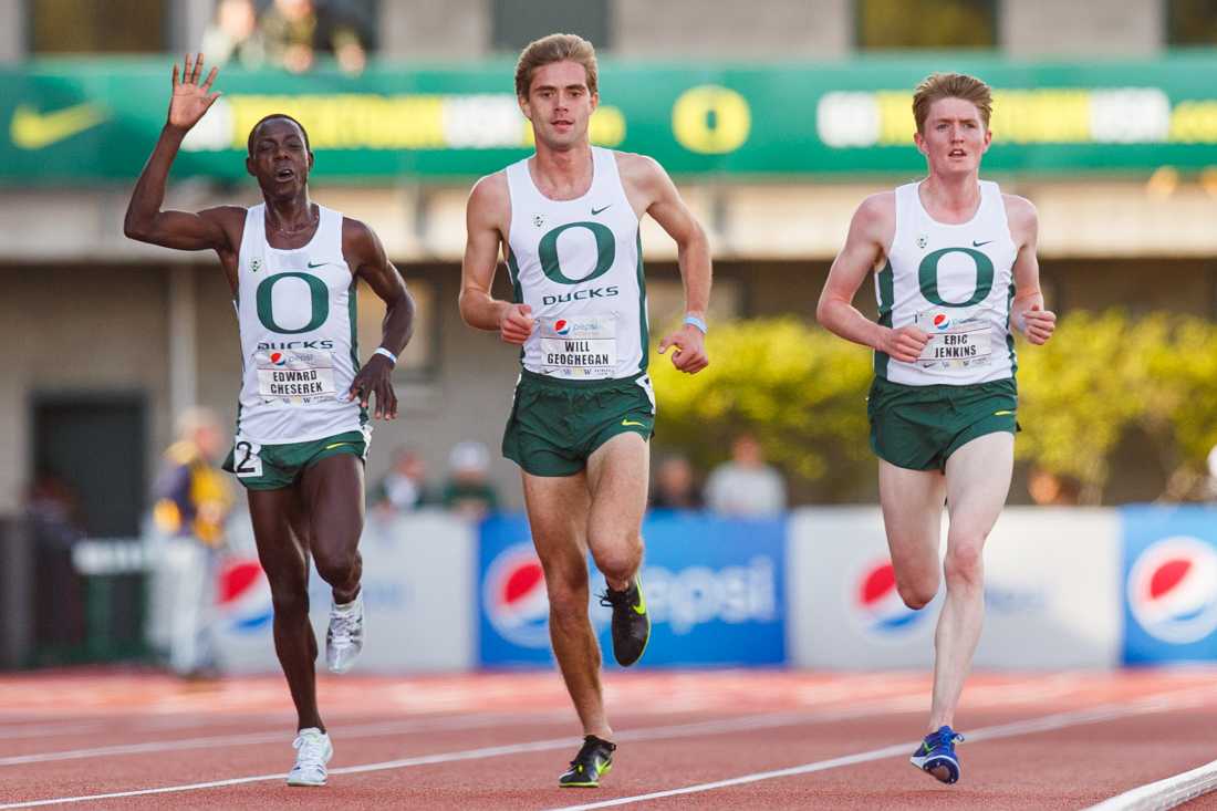 Oregon distance runners Edward Cheserek, Will Geoghegan, and Eric Jenkins pump up the crowd as they finish the men&#8217;s 5000 meter race. The Oregon Ducks hosts the annual Pepsi Invitational at Hayward Field in Eugene, Ore. on Saturday, April 11, 2015. (Taylor Wilder/Emerald)