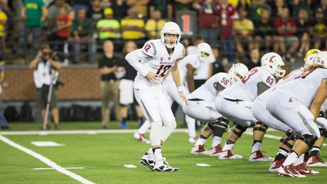 Washington State Cougars quarterback Connor Halliday (12) yells the play at the offensive line during the game. Halliday is graduating this year and redshirt sophomore Luke Falk will most likely replace him. (Taylor Wilder/Emerald)