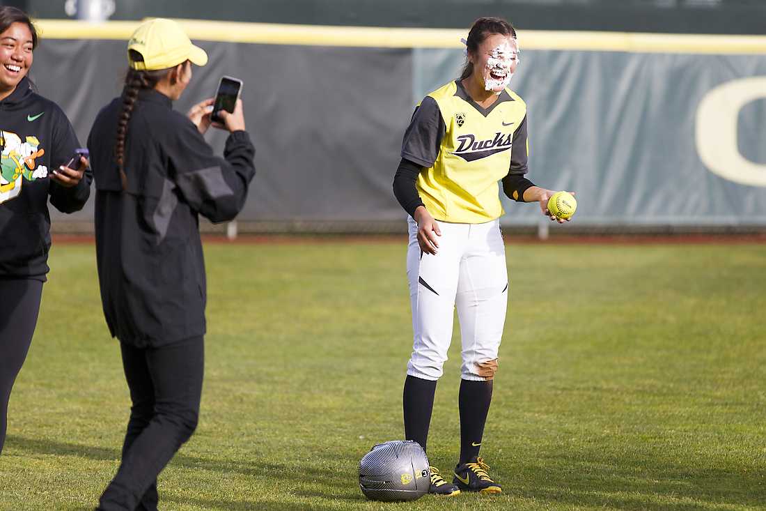 Oregon outfielder Janie Takeda (19) has a pile of whipped cream shoved in her face after the game. The Oregon Ducks play the Louisiana Ragin&#8217; Cajuns at Howe Field in Eugene, Oregon on April 24, 2015. (Ryan Kang/Emerald)