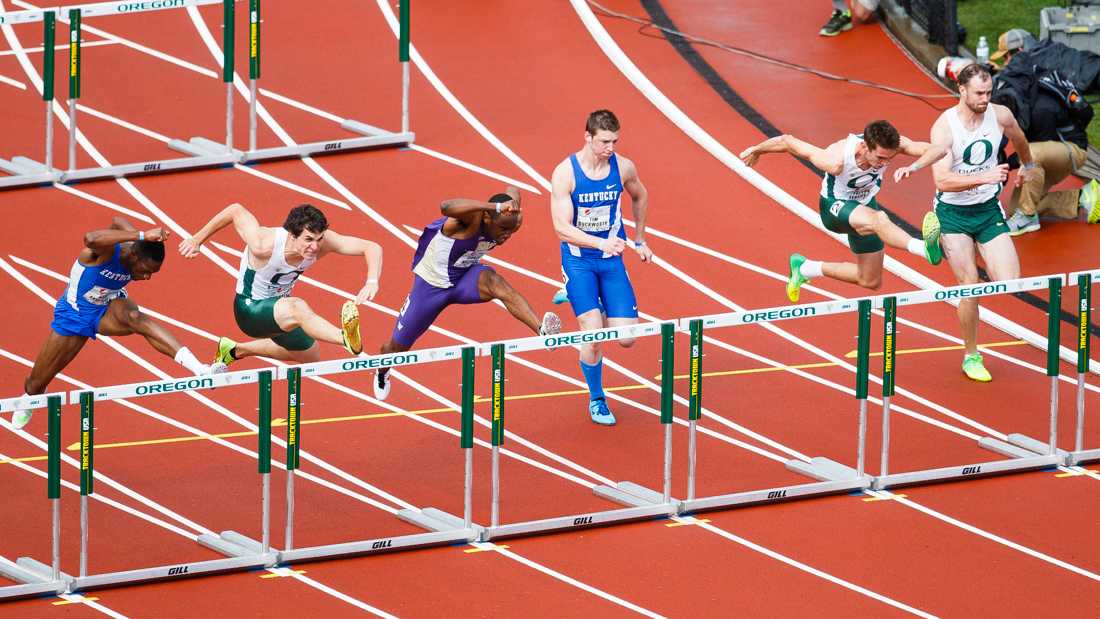 Athletes make their way over the second hurdle during the men&#8217;s 110 meter hurdle race. The Oregon Ducks hosts the annual Pepsi Invitational at Hayward Field in Eugene, Ore. on Saturday, April 11, 2015. (Taylor Wilder/Emerald)