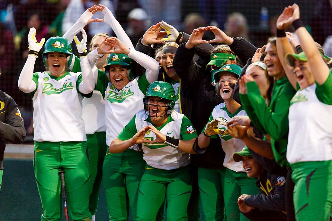 The Oregon softball team welcomes Oregon infielder Nikki Udria (3) to home plate after hitting a walk-off home run during the sixth inning. The Oregon Ducks play the ASU Sun Devils at Howe Field in Eugene, Oregon on April 11, 2015. (Ryan Kang/Emerald)