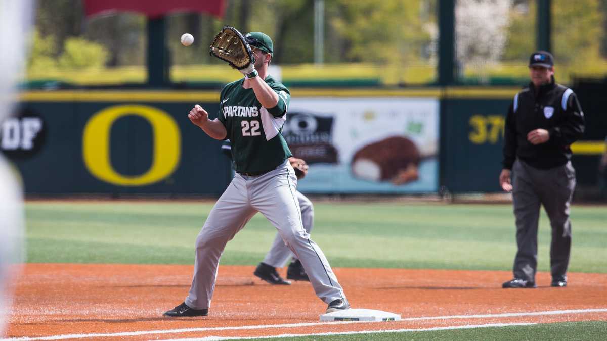 Michigan State first baseman Ryan Krill (22) outs an Oregon batter during the bottom of the second inning. The Oregon Ducks play the Michigan State Spartans at PK Park in Eugene, Ore. on Sunday, April 5, 2015. (Taylor Wilder/Emerald)