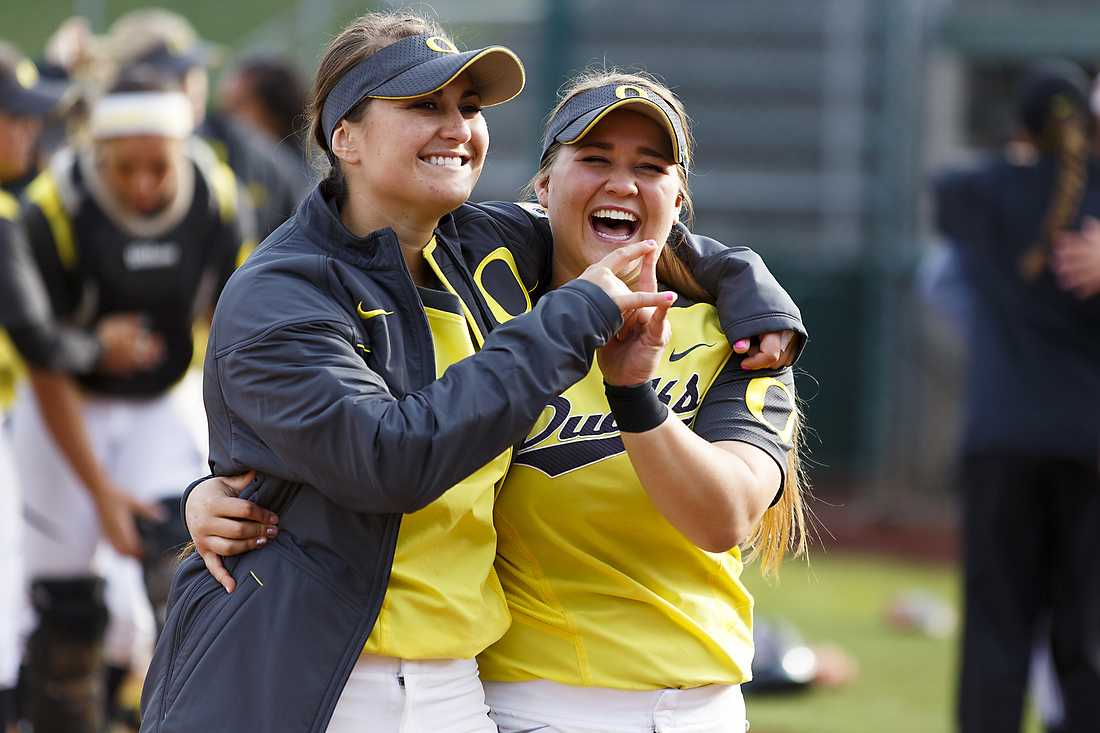 Oregon outfielder Koral Costa (7) and Oregon infielder Hailey Decker (14) share a smile after the game. The Oregon Ducks play the Louisiana Ragin&#8217; Cajuns at Howe Field in Eugene, Oregon on April 24, 2015. (Ryan Kang/Emerald)