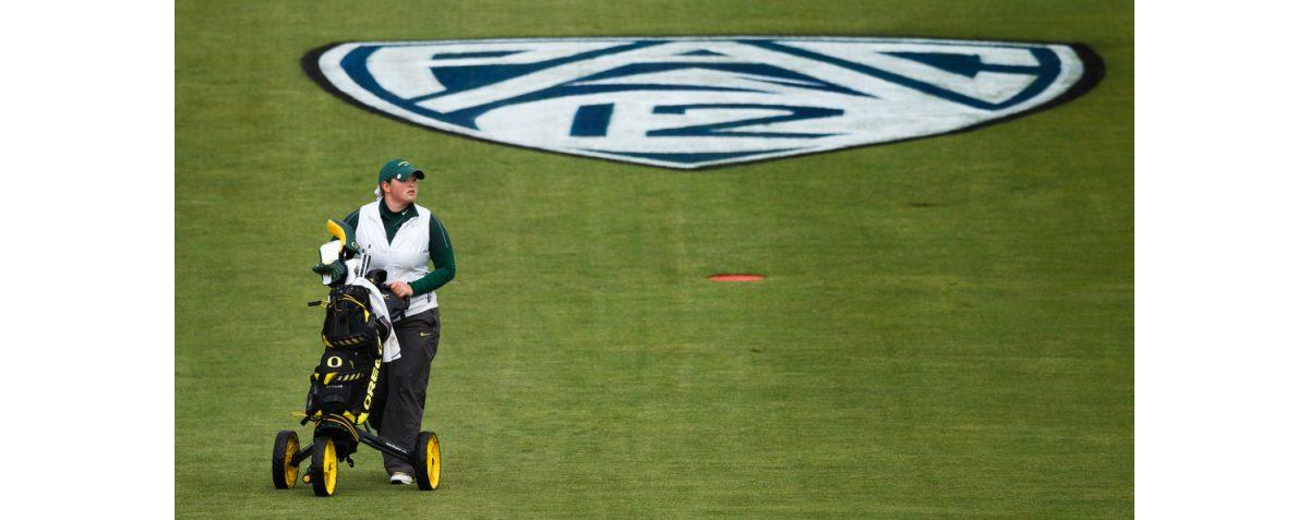 Oregon junior Caroline Inglis walks down the eighteenth fairway by the painted Pac-12 logo. (Ryan Kang/Emerald)