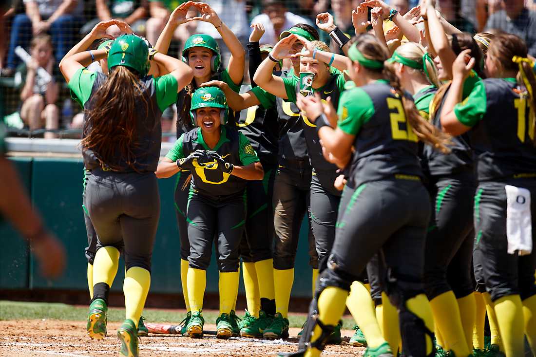 Oregon outfielder Koral Costa (7) is welcomed at home plate after hitting a home run during the second inning. The Oregon Ducks play the California Golden Bears at Howe Field in Eugene, Oregon on May 3, 2015. (Ryan Kang/Emerald)