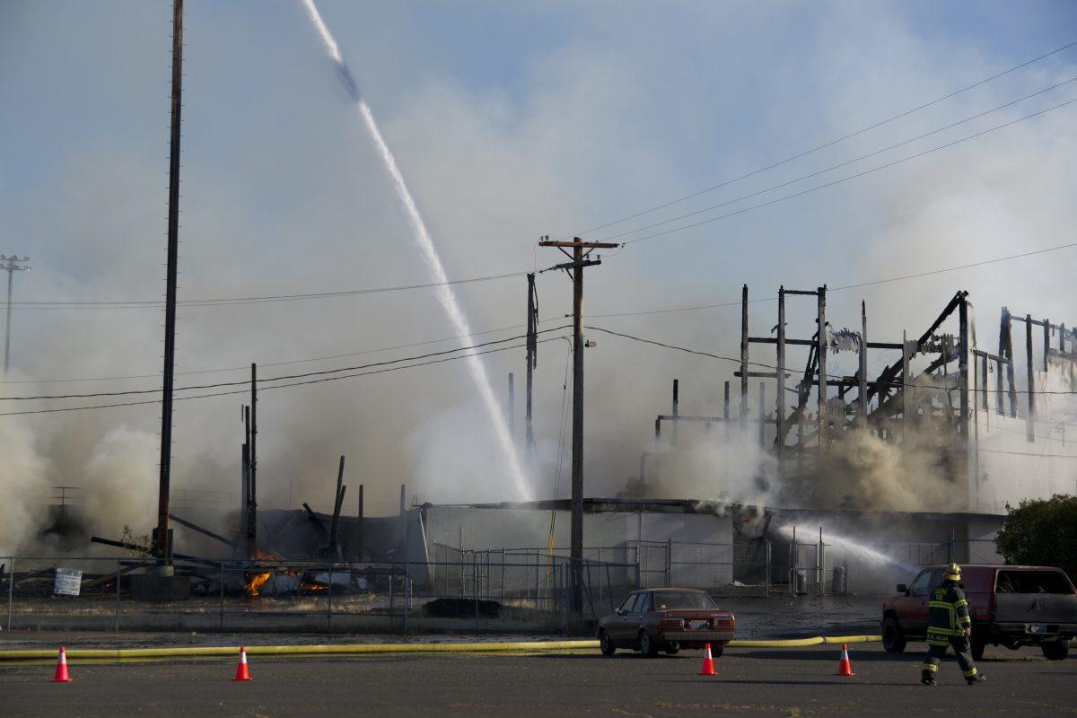 Fire personnel putting out the flames at Civic Stadium (Meerah Powell/Emerald)