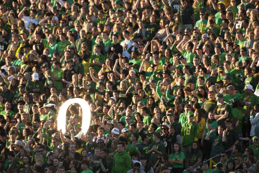 The student section glows in a classic Eugene sunset. The No. 13 Oregon Ducks face No. 18 Utah in Eugene Oregon on September 26, 2015. (Cole Elsasser/Emerald)