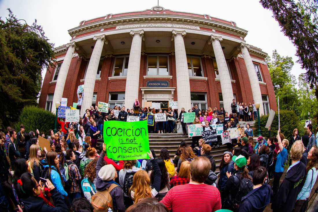 Rally participants gather outside of Johnson Hall after unsuccessfully receiving an answer from University of Oregon administrators inside Johnson Hall. UO Coalition to End Sexual Violence, Safe Ride, and other campus groups organize a rally to show support for survivors of sexual assault on Thurs., May 8, 2014. (Ryan Kang/Emerald)