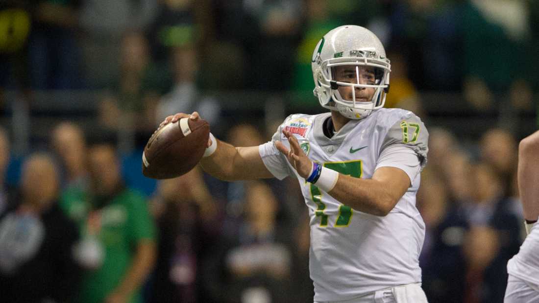 Oregon Ducks quarterback Jeff Lockie (17) looks for a teammate to pass to. The No. 15 Oregon Ducks face the No. 11 TCU Horned Frogs in the Valero Alamo Bowl at The Alamo Dome in San Antonio, Texas on Jan. 2, 2016. (Adam Eberhardt/Emerald)