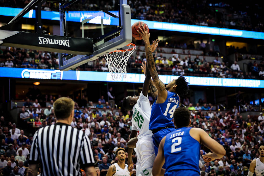 Oregon Center Chris Boucher contests Duke guard Brandon Ingram at the rim. The Oregon Ducks face the Duke Blue Devils on March 24, 2016 in the Sweet 16 at the Honda Center. (Kyle Sandler/Emerald)