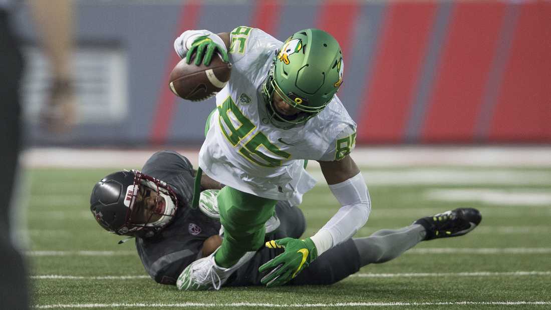 <p>Oregon Ducks tight end Pharaoh Brown (85) is brought down by a Washington State player. The Oregon Ducks play the Washington State Cougars at Martin Stadium in Pullman, Wash. on Oct. 1, 2016. (Adam Eberhardt/Emerald)</p>