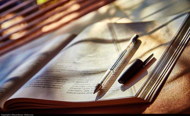 A student using pen and book for studying.(Flickr Moyan Brenn)