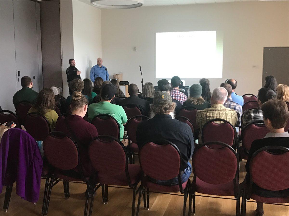 Students and faculty watch an active shooter response training presentation in the EMU ballroom. (Jack Pitcher/Emerald)