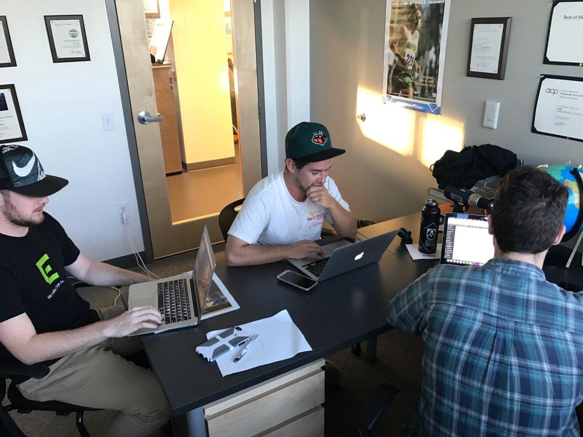 Jarrid Denney, Kenny Jacoby, and Cooper Green editing the story at the Emerald office in November. (Jonathan Hawthorne/Emerald)