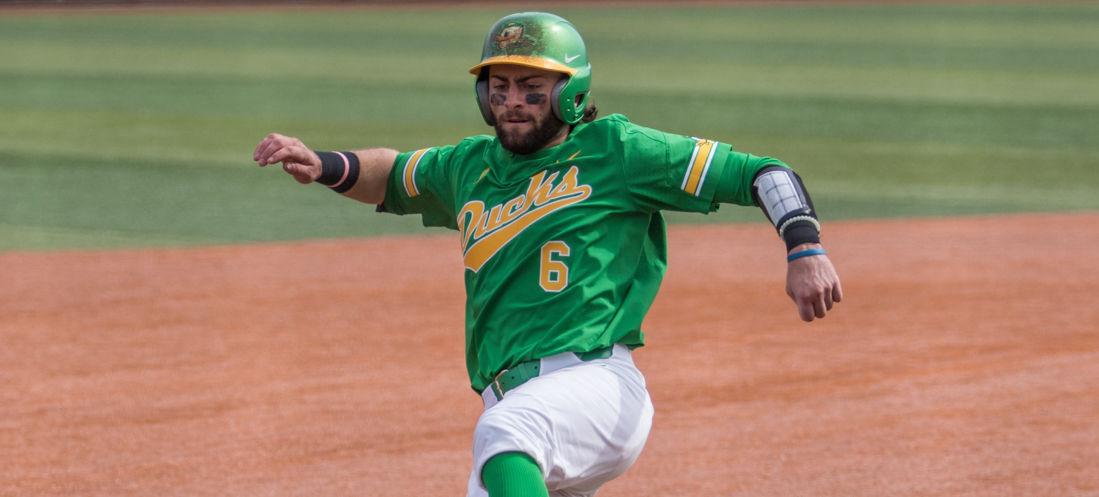 <p>Tim Susnara (6) slides into third base. The Oregon Ducks face the USC Trojans at PK Park in Eugene, Oregon on Friday, April 16. (Samuel Marshall/Emerald)</p>