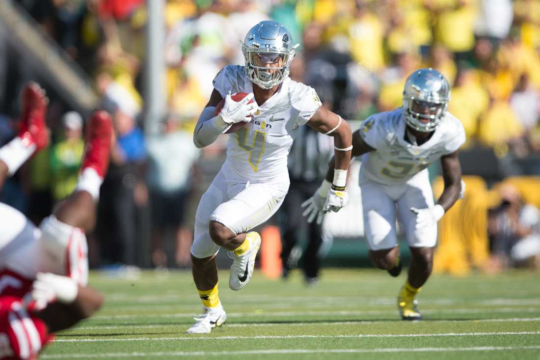 Oregon cornerback Thomas Graham Jr. (4) returns the ball after making an interception. The Oregon Ducks host the Nebraska Cornhuskers at Autzen Stadium in Eugene, Ore. on Saturday, Sept. 9, 2017. (Adam Eberhardt/Emerald)