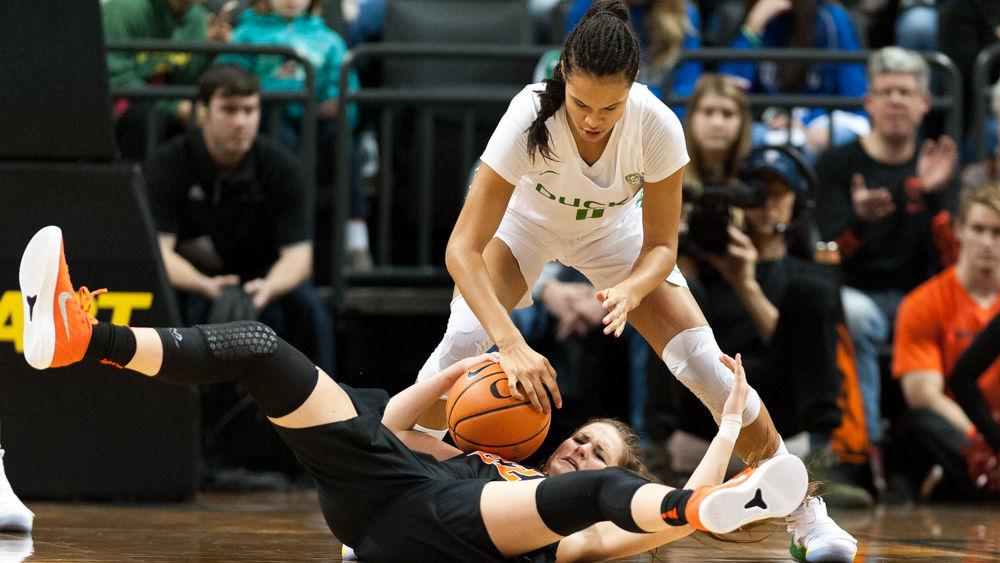 Ducks forward Satou Sabally (0) fights for the ball with Beaver guard Kat Tudor (22). University of Oregon basketball take on Oregon State at Matthew Knight Arena in Eugene, Ore. on Jan. 21st, 2018. (Ben Green/Emerald)