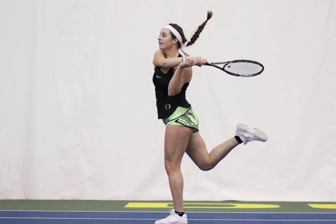 Oregon Ducks Paiton Wagner swings for the return during her singles match. The Oregon Ducks face the Portland State Vikings at the Oregon Student Tennis Center in Eugene, Ore. on January 19, 2018. (Devin Roux/Emerald)