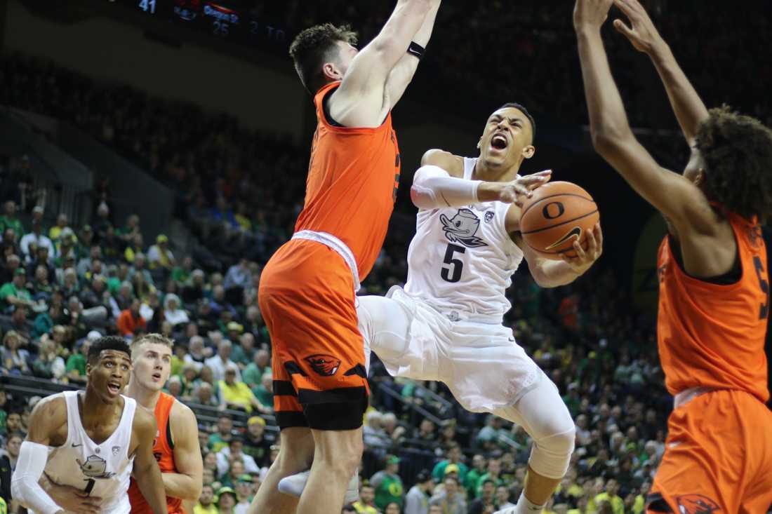 Oregon Ducks guard Elijah Brown (5) attempts to shoot the ball under pressure. Oregon basketball take on the Oregon State Beavers at Matthew Knight Arena in Eugene, Ore. on Jan. 27, 2018. (Devin Roux/Emerald)