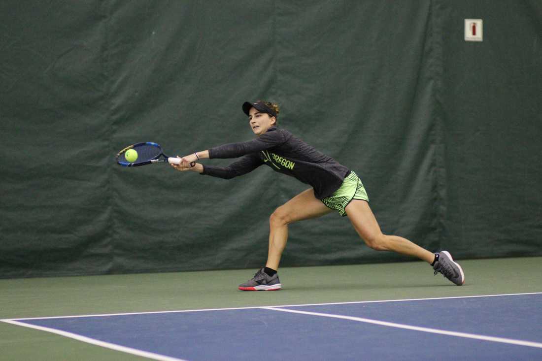 Oregon Ducks Daniela Nasser reaches out for the return during her singles match. The Oregon Ducks face the Portland State Vikings at the Oregon Student Tennis Center in Eugene, Ore. on January 19, 2018. (Devin Roux/Emerald)