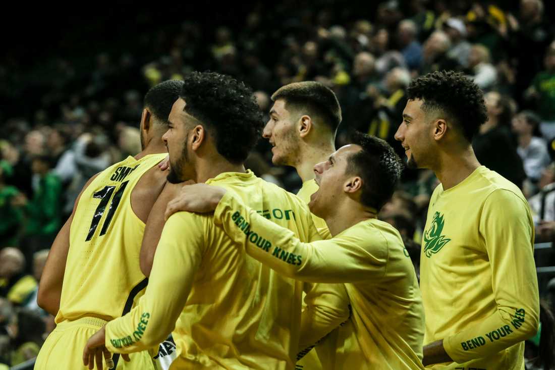 The Oregon Ducks celebrate after a score. Oregon basketball take on the Washington Cougars at Matthew Knight Arena in Eugene, Ore. on Feb. 11, 2018. (Natalie Waitt-Gibson/Emerald)