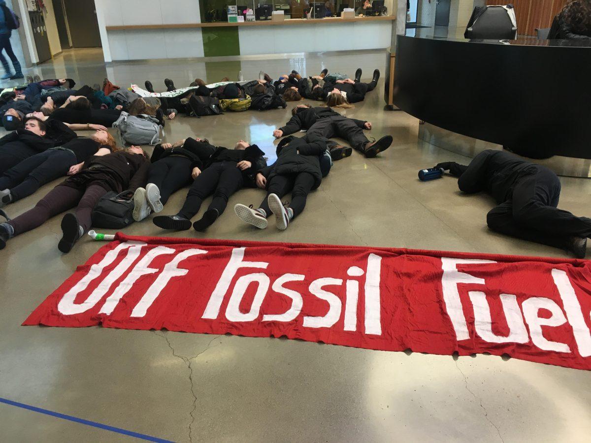 Protesters from Climate Justice League stage a &#8220;die-in&#8221; in the EMU. (Frankie Benitez/Emerald)