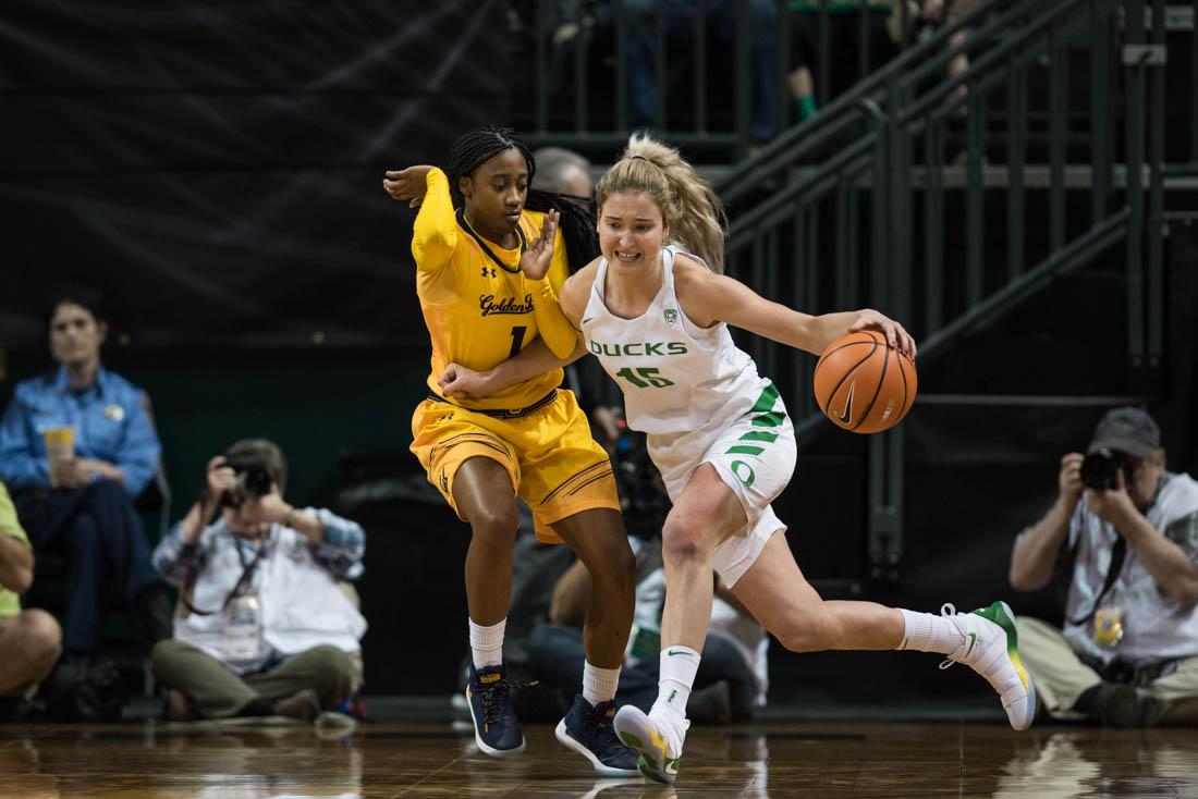 Oregon guard Anneli Maley (15) fights past a defender. The Oregon Ducks face the California Golden Bears at Matthew Knight Arena in Eugene, Ore. on Feb. 2, 2017. (Phillip Quinn/Emerald)