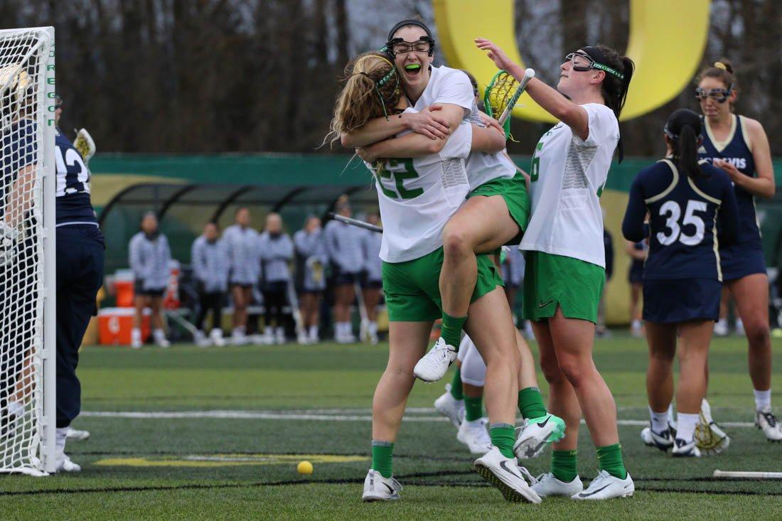 The Ducks celebrate a goal. The Oregon Ducks play the UC Davis Aggies at Pape Field in Eugene, Ore. on Feb. 16, 2018. (Devin Roux/Emerald)