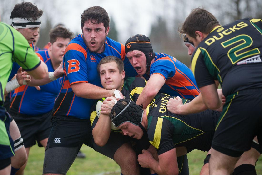 Charles Diemer gets tackled by Boise State players. (Adam Eberhardt/Daily Emerald)