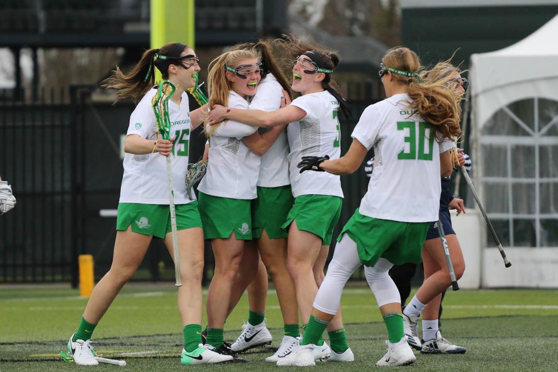 The Oregon Ducks celebrate a goal. The Oregon Ducks play the UC Davis Aggies at Pape Field in Eugene, Ore. on Feb. 16, 2018. (Devin Roux/Emerald)