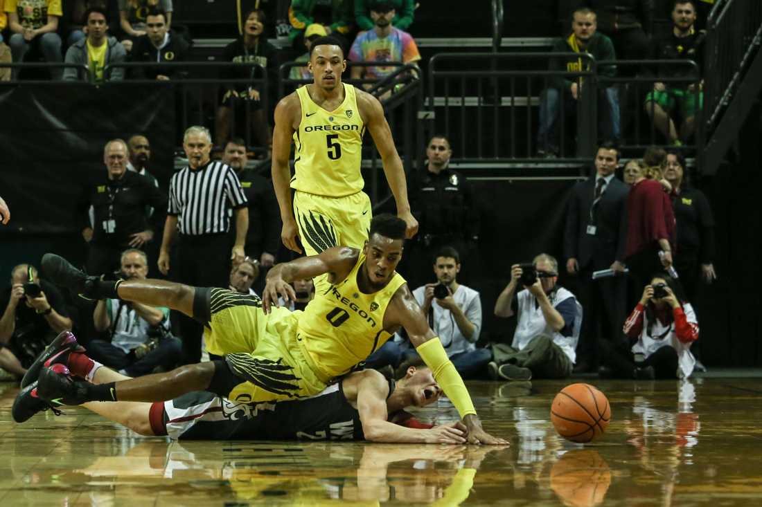 Oregon forward Troy Brown lunges for the ball. Oregon basketball take on the Washington Cougars at Matthew Knight Arena in Eugene, Ore. on Feb. 11, 2018. (Natalie Waitt-Gibson/Emerald)