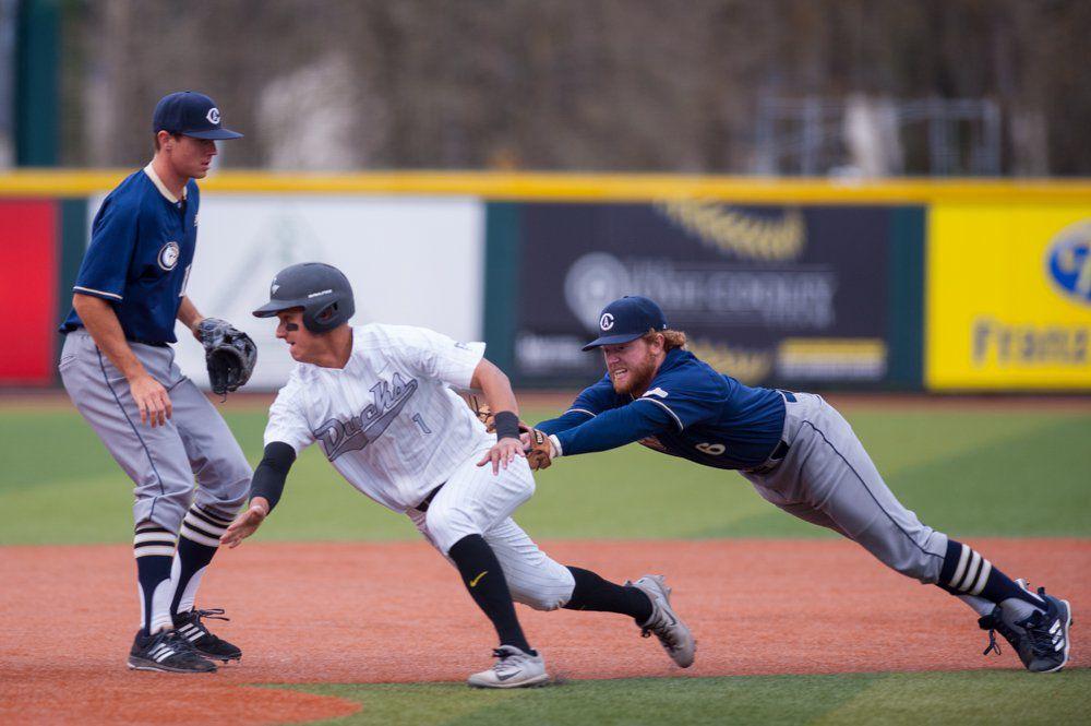 Ducks infielder Kyle Kasser (1) gets tagged out inches from third base. The Oregon Ducks play the UC Davis Aggies at PK Park in Eugene, Ore. on Saturday March 10, 2018. (Ben Green/Emerald)