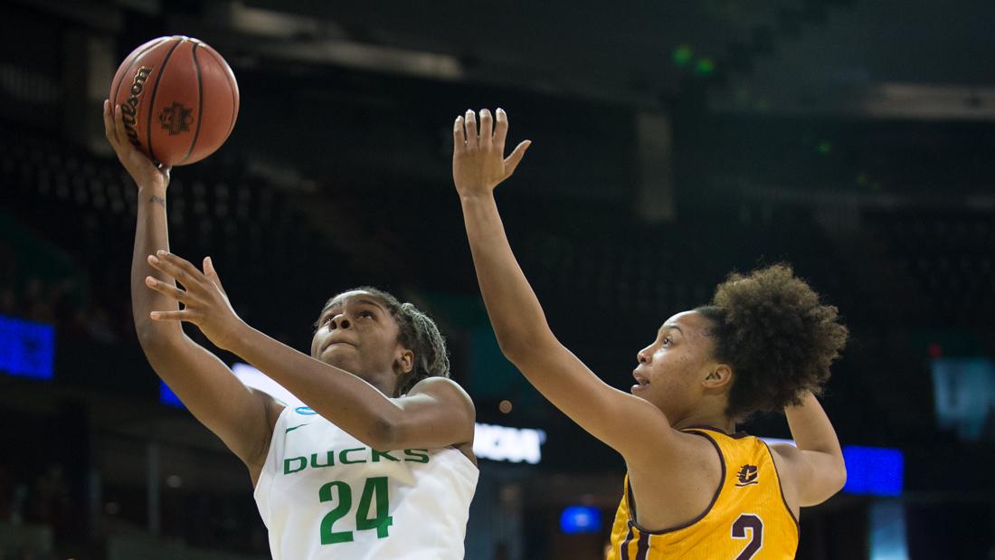 Oregon Ducks forward Ruthy Hebard (24) gets past Central Michigan forward Tinara Moore (2) for a layup. The Oregon Ducks play the Central Michigan Chippewas in the Sweet 16 round of the NCAA tournament at the Spokane Veterans Memorial Arena in Spokane, Wash. on Saturday, March 24, 2018. (Adam Eberhardt/Emerald)