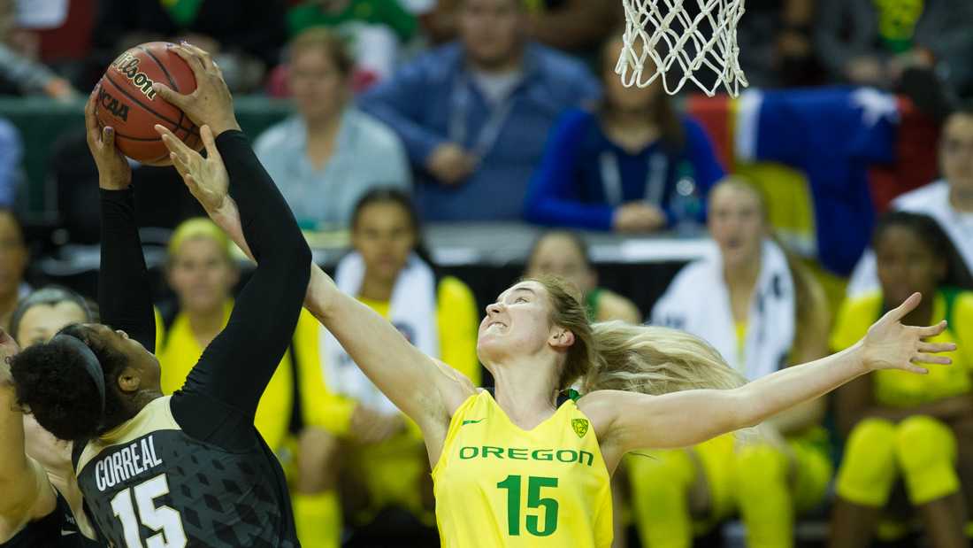 Oregon Ducks guard Anneli Maley (15) and Colorado Buffaloes center Zoe Correal (15) reach for the ball. The Oregon Ducks face the Colorado Buffaloes in the quarter finals of the Pac-12 Tournament at KeyArena in Seattle, Wash. on Friday, March 2, 2018. (Adam Eberhardt/Emerald)