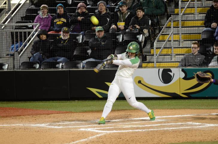 Mia Camuso, in-fielder for the UO, swings at the ball during the game against Weber State. The University of Oregon wins 9-1 against Weber State, 3/9/18. (Emerald/ Madi Mather)