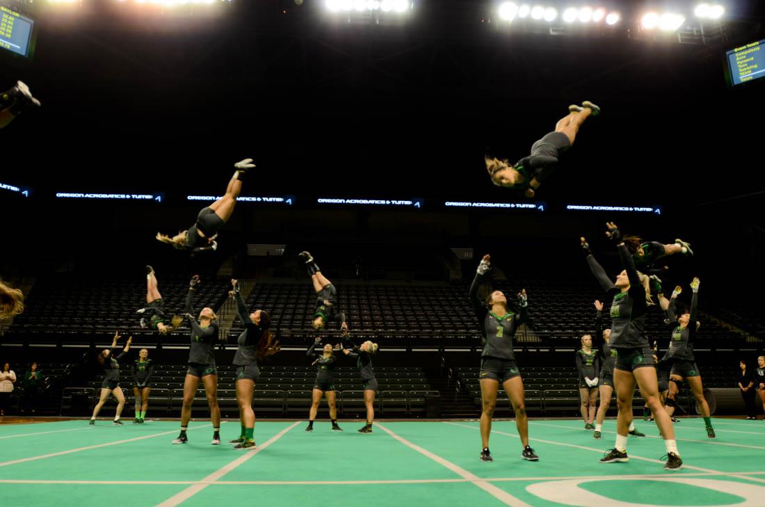 The Oregon Ducks perform acrobatics while completeing their final team routine. Oregon Acrobatics and Tumbling falls to Baylor 824.285-286.75 in rematch for final home meet at Matthew Knight Arena on April 8, 2018. (Madi Mather/Emerald)