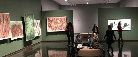 <p>Museum-goers look at paintings by Eugene-based artist Keith Achepohl in the Barker Gallery of the Jordan Schnitzer Museum of Art. (Courtesy of JSMA Instagram)</p>