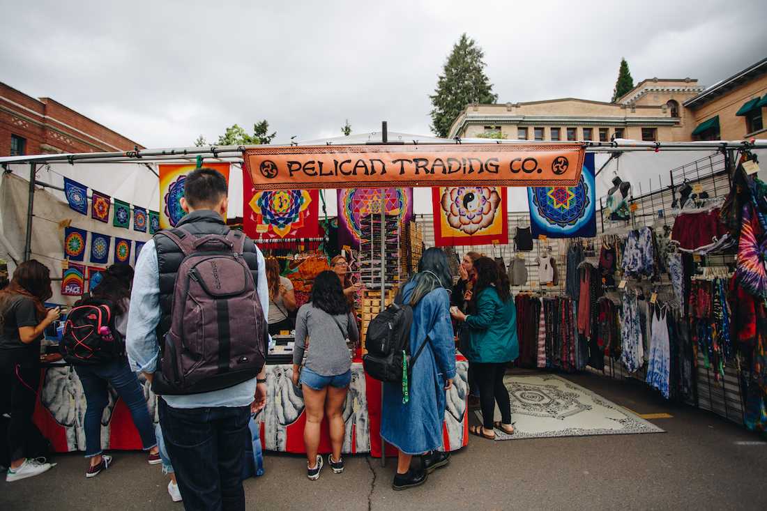 The colorful Pelican Trading Co. tent gathers students attending the Street Faire. The ASUO Spring Street Faire takes place at the University of Oregon on May 9-11, 2018. (Sarah Northrop/Emerald)