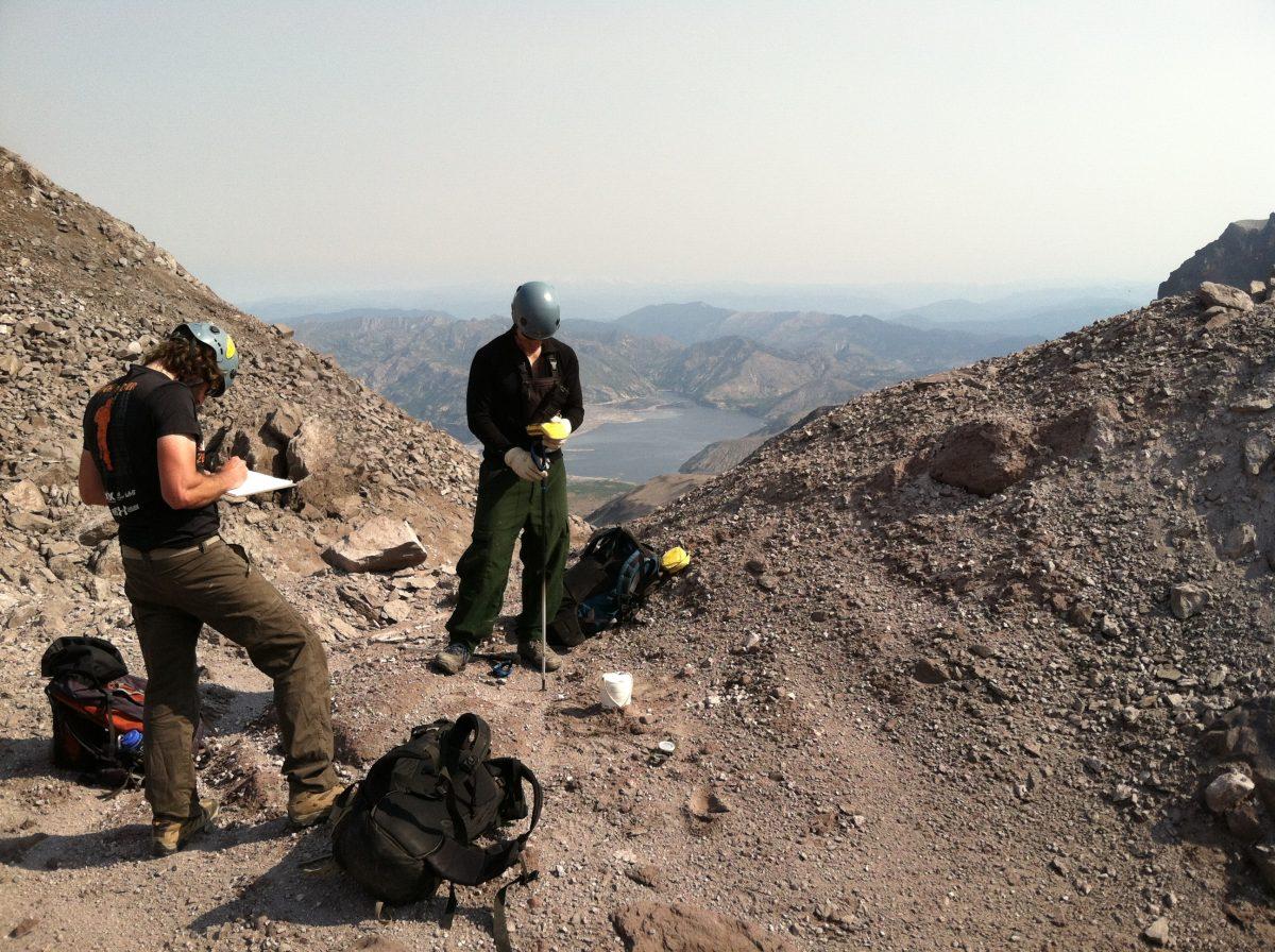 University of New Mexico geologist Steve Hansen, left, and USGS Cascades Volcano Observatory research scientist Wes Thelen doing seismic fieldwork in the crater at Mount St. Helens. (Courtesy of Brandon Schmandt)