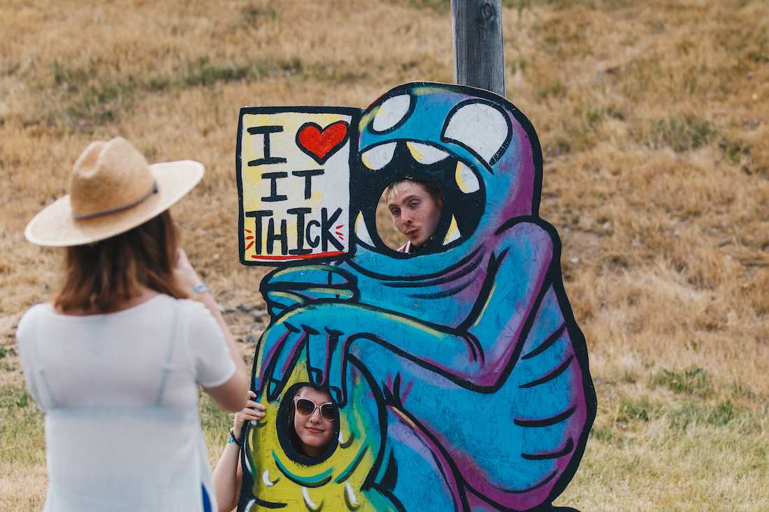 Festival-goers pose for a photo with a cutout. Many artful photo cutouts line the pathway leading to the Sasquatch! main stage. Day one of Sasquatch! Music Festival kicks off on May 25, 2018. (Sarah Northrop/Emerald)