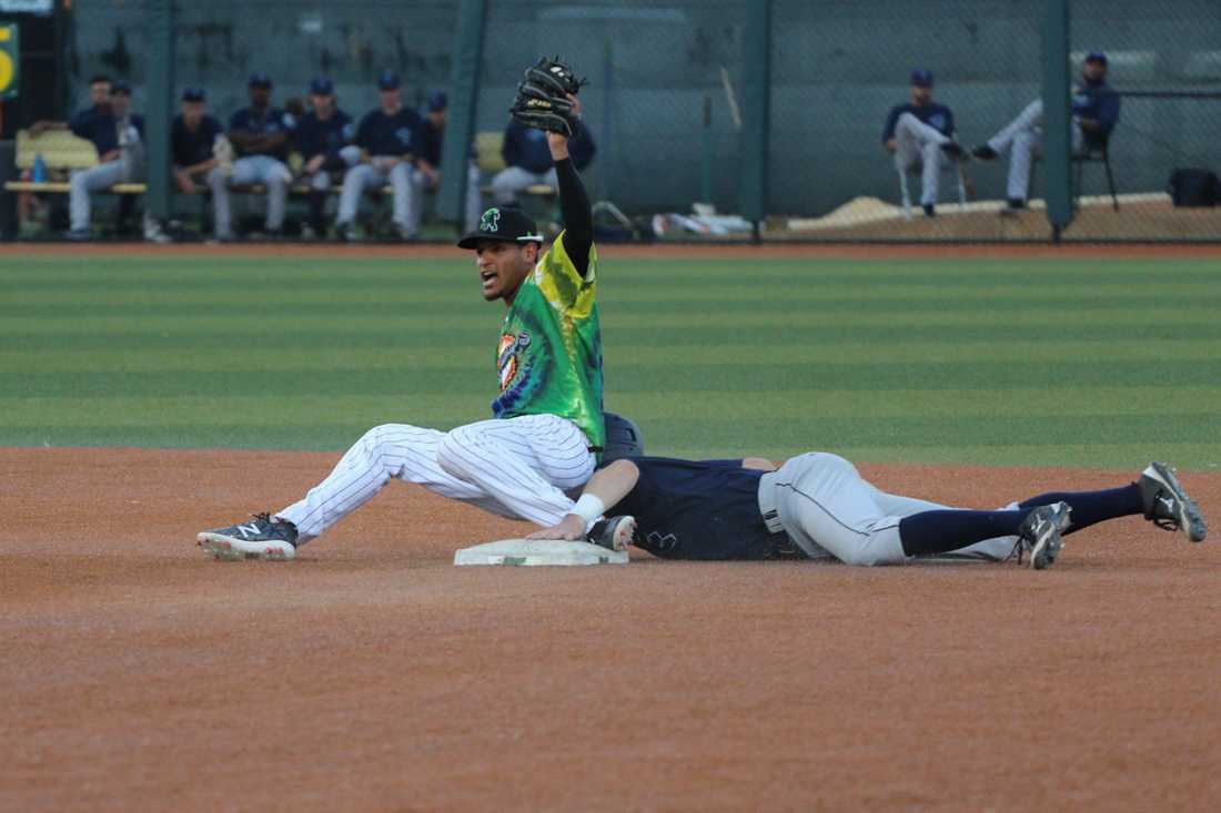 Eugene Emeralds infielder Luis Vazquez (7) tags out a Everett AquaSox at second. The Eugene Emeralds host the Everett AquaSox at PK Park in Eugene, Ore. on June 29, 2018. (Devin Roux/Emerald)