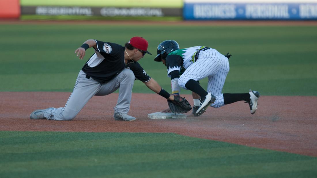 Eugene Emeralds outfielder Fernando Kelli (5) dives to second. The Eugene Emeralds host the Salem-Keizer Volcanoes at PK Park in Eugene, Ore. on July 25, 2018. (Devin Roux/Emerald)