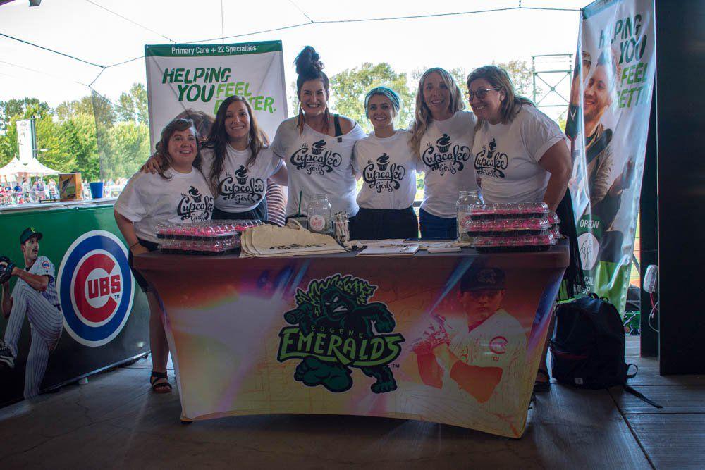 At the July 3 Eugene Emeralds game, people walked the concourse with the usual staples &#8212; ketchup covered hot dogs, fries and something new: bright pink cupcakes. The cupcakes are staples of a new nonprofit in Lane County known as The Cupcake Girls. The cupcakes are from the table covered &#8230;