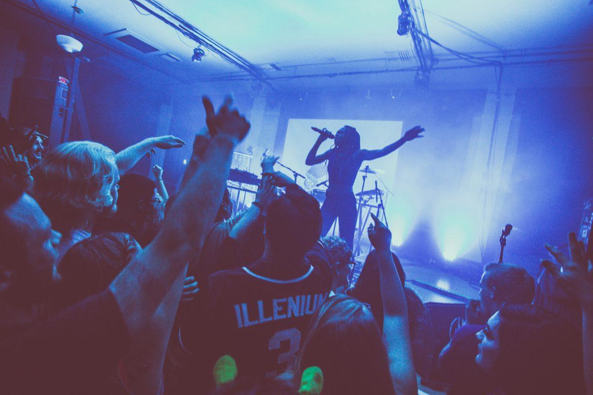 Accompanying Mura Masa on stage, English vocalist Fliss sings and rallies the crowd. Electronic music producer Mura Masa performs a set at the WOW Hall in Eugene, Ore. on Aug. 30, 2018. (Sarah Northrop/Emerald)