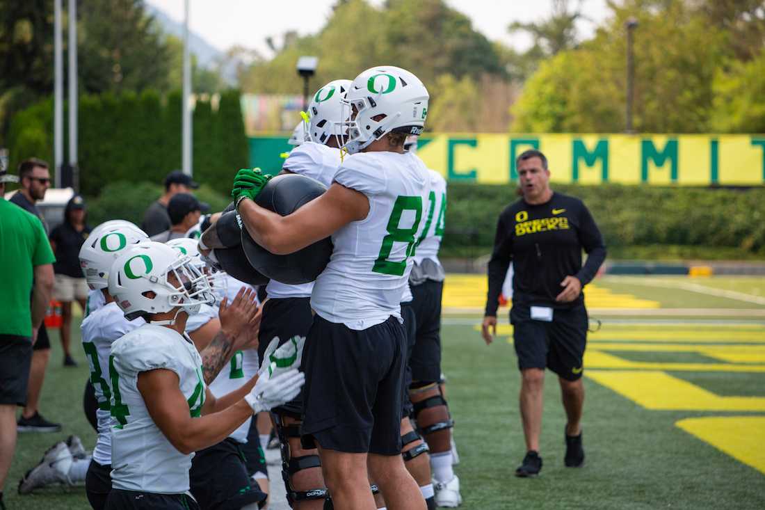 Head coach Mario Cristobal works with the offensive linemen. Ducks Football practices at the Hatfield-Dowlin Complex practice fields on Aug. 14, 2018. (Sarah Northrop/Emerald)