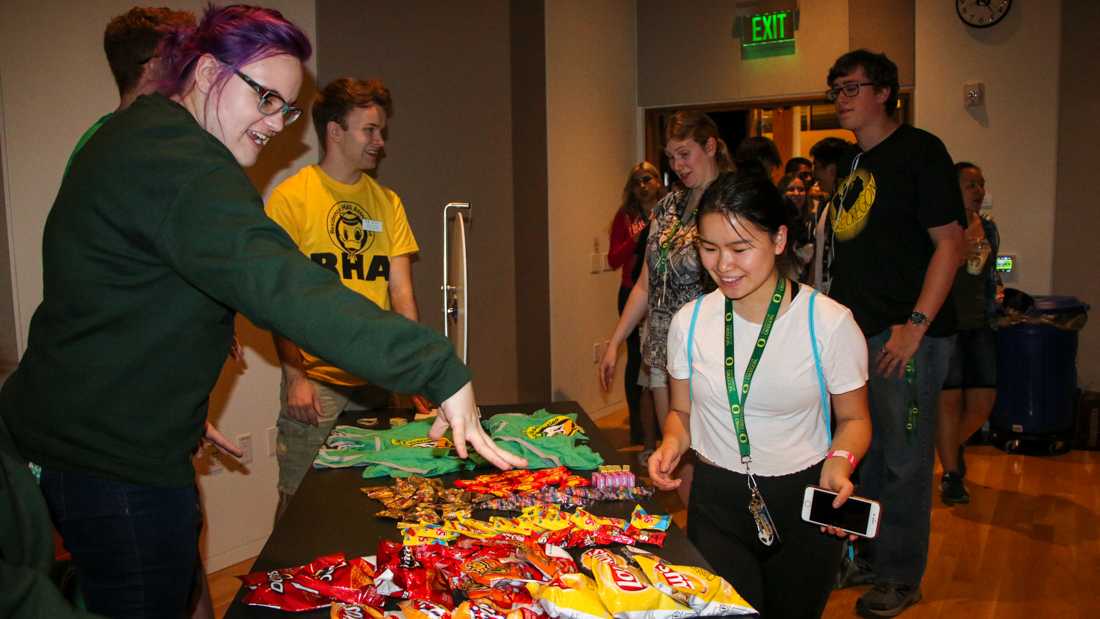 On Thursday nights in the Erb Memorial Union, the Redwood Auditorium smells like fresh popcorn and is filled with over a hundred University of Oregon students. Attendees dance to music and socialize while they wait in line for Ducks After Dark to begin. The weekly event is open to all &#8230;